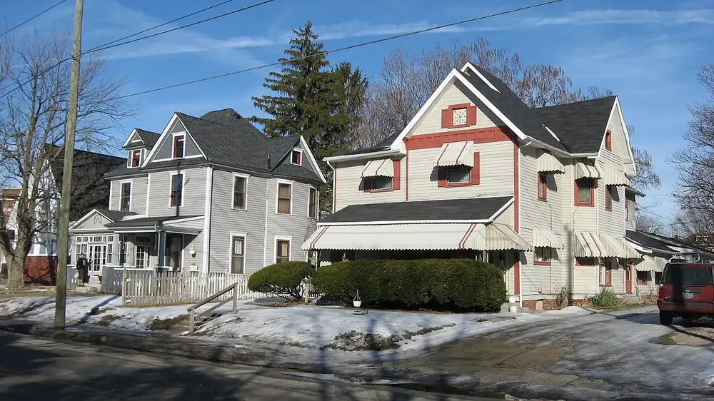 A row of older two-story frame houses on Ritter Avenue in Irvington with snow on the ground
